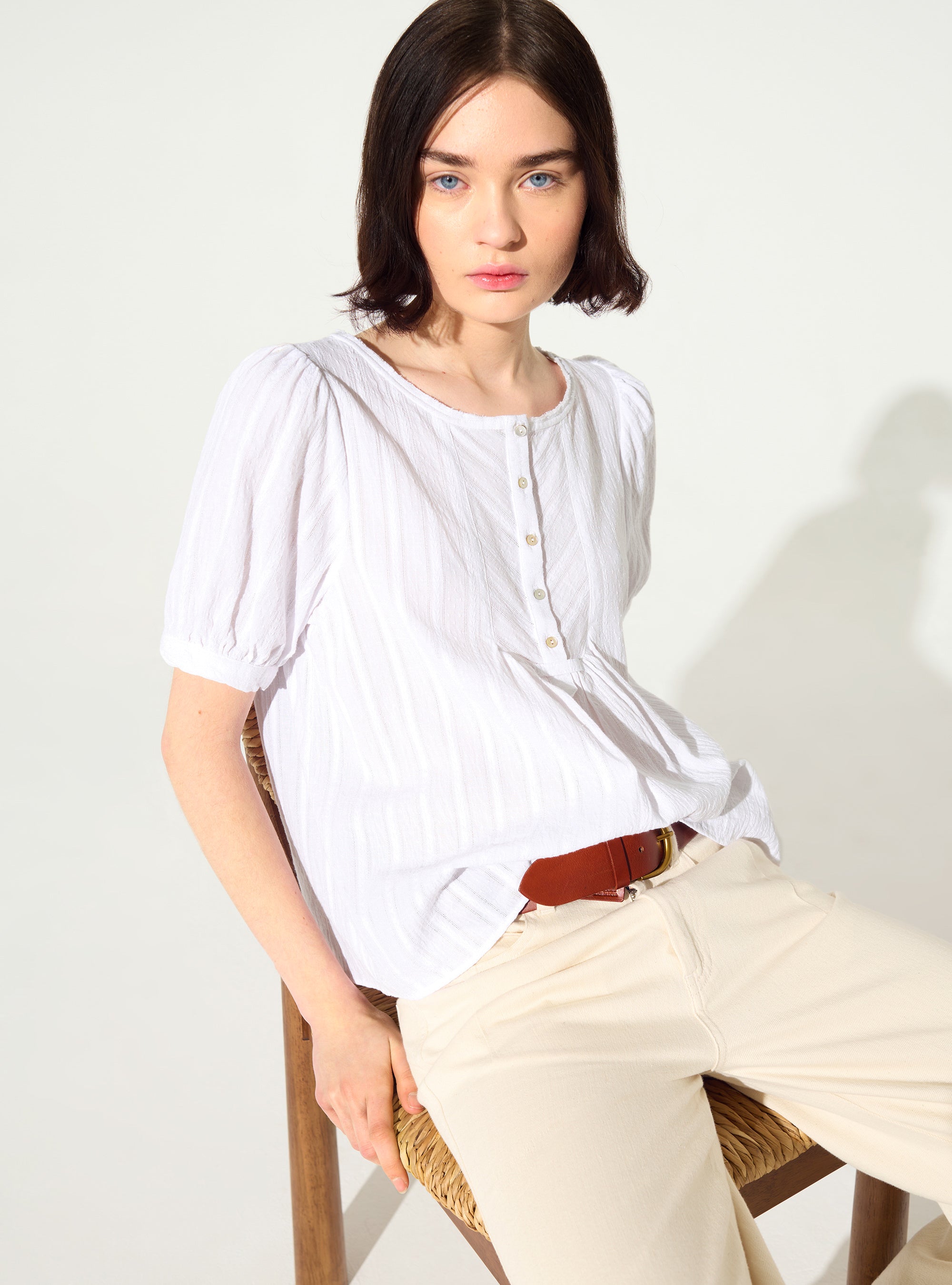 Loose-fitting white cotton blouse