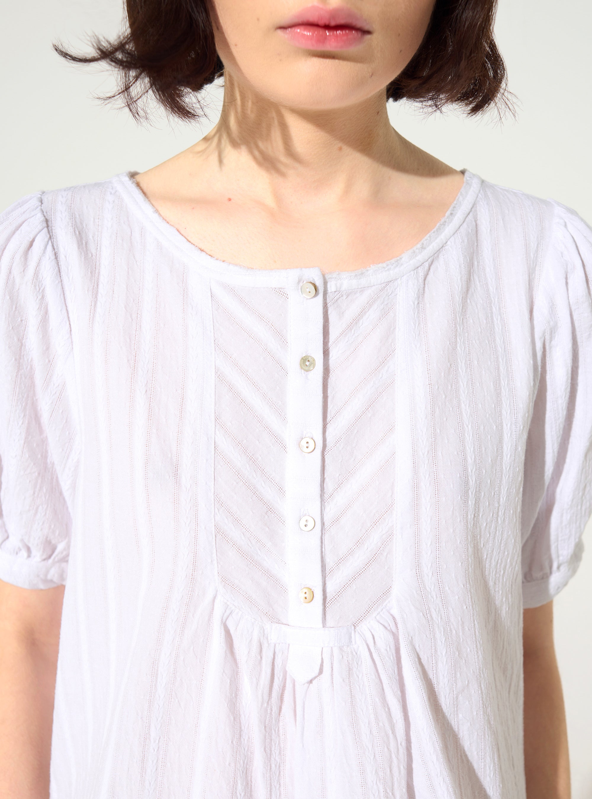 Loose-fitting white cotton blouse