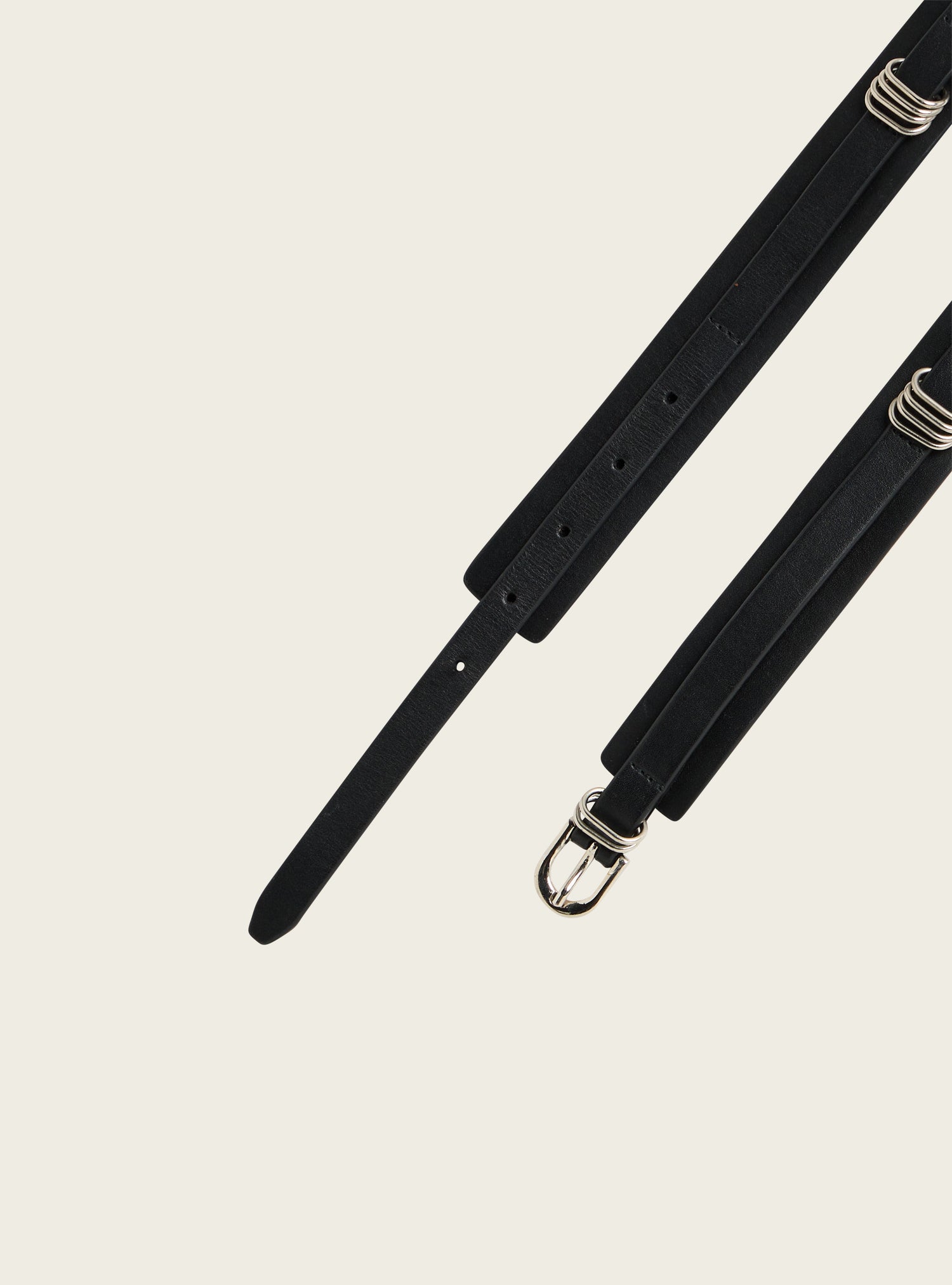 Leather belt with silver eyelets