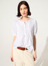 Loose-fitting white cotton blouse