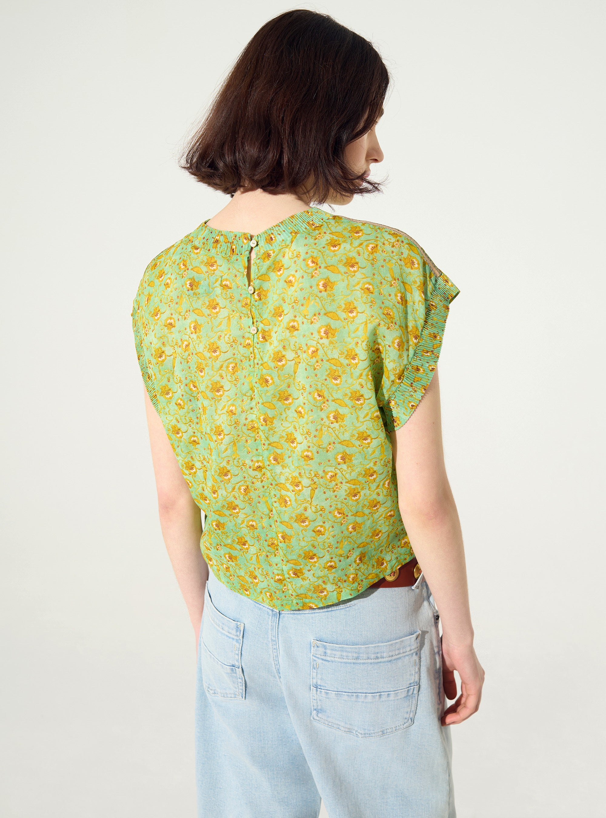 Fitted pleated printed blouse in green cotton